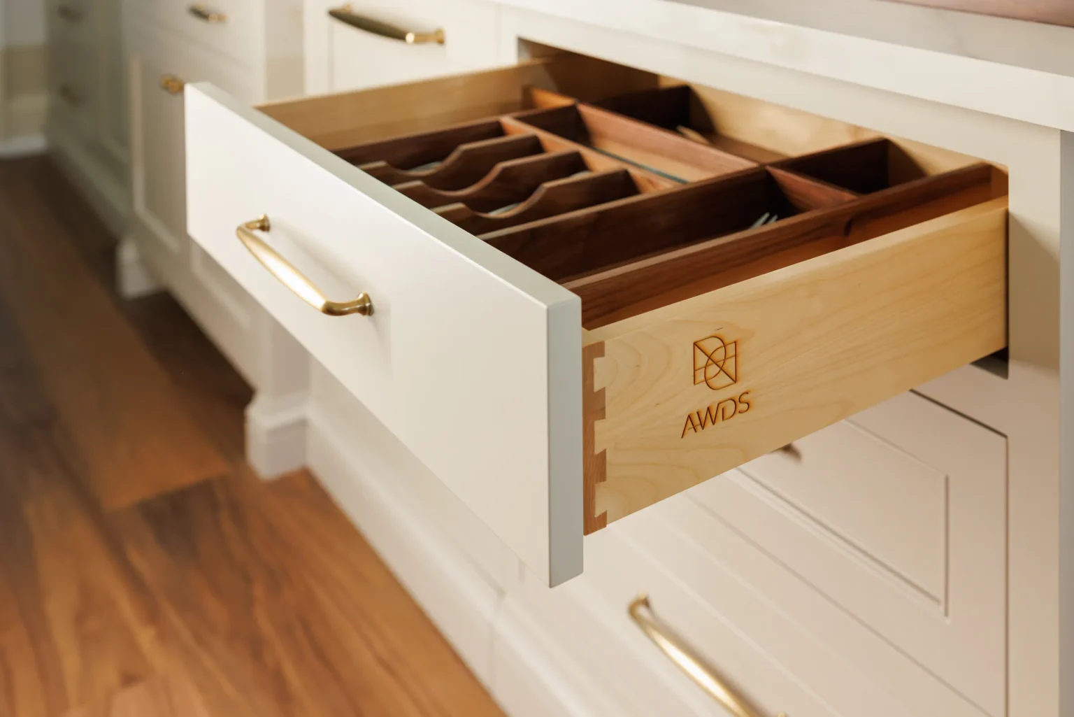 Open dovetailed drawer with a walnut cutlery insert