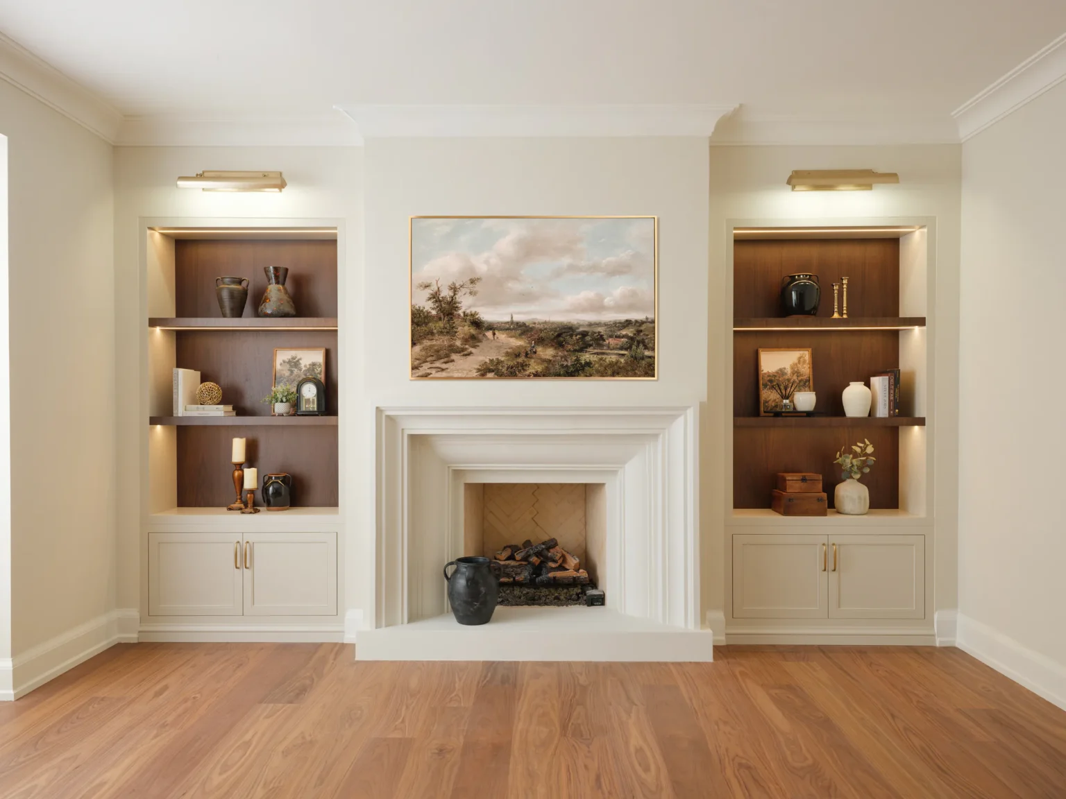 Fireplace millwork with built-in shelving and cabinetry on both sides