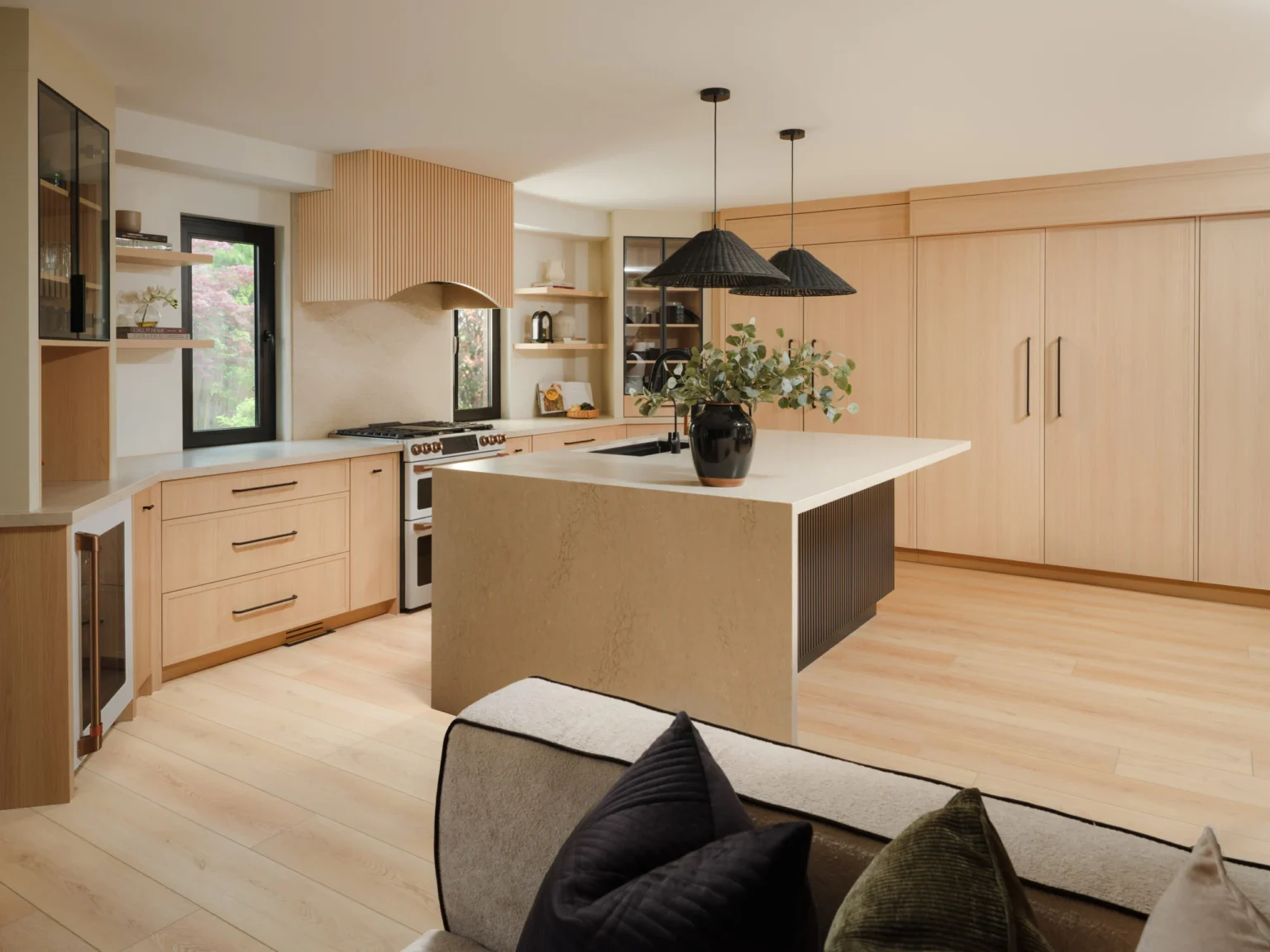 Custom kitchen in Oakville, Ontario with a large island, pendant lighting and tall custom cabinetry