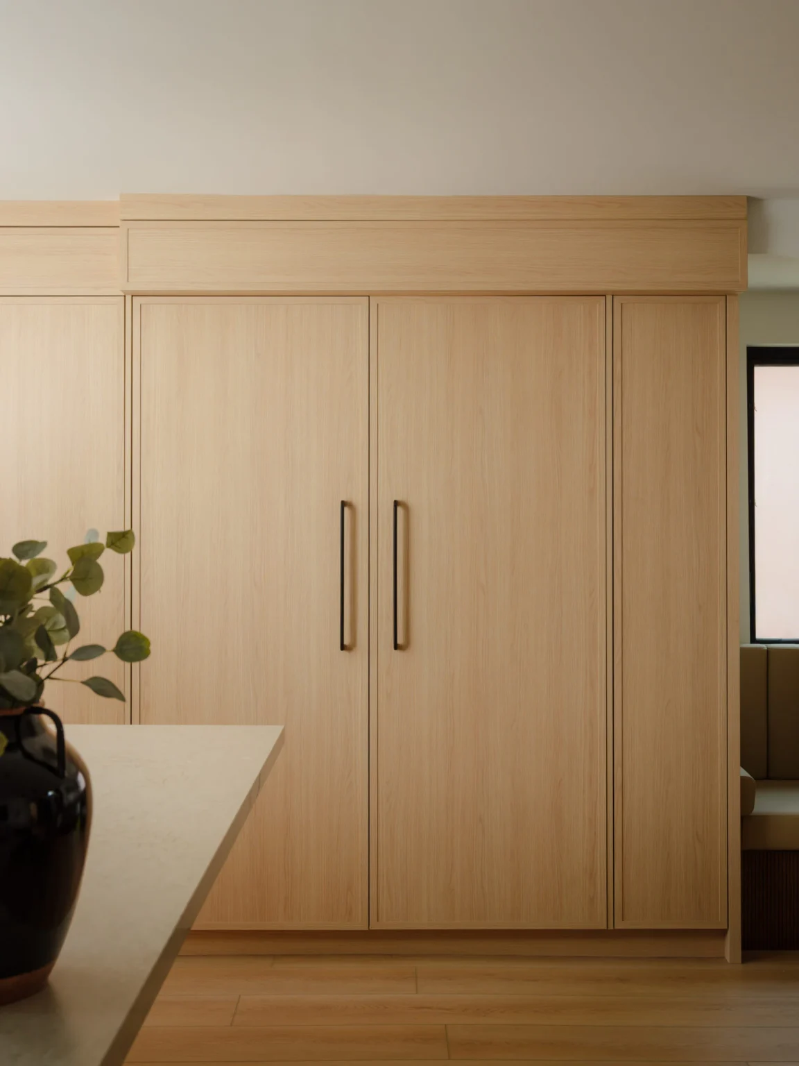 Tall custom cabinetry with large pocket doors closed