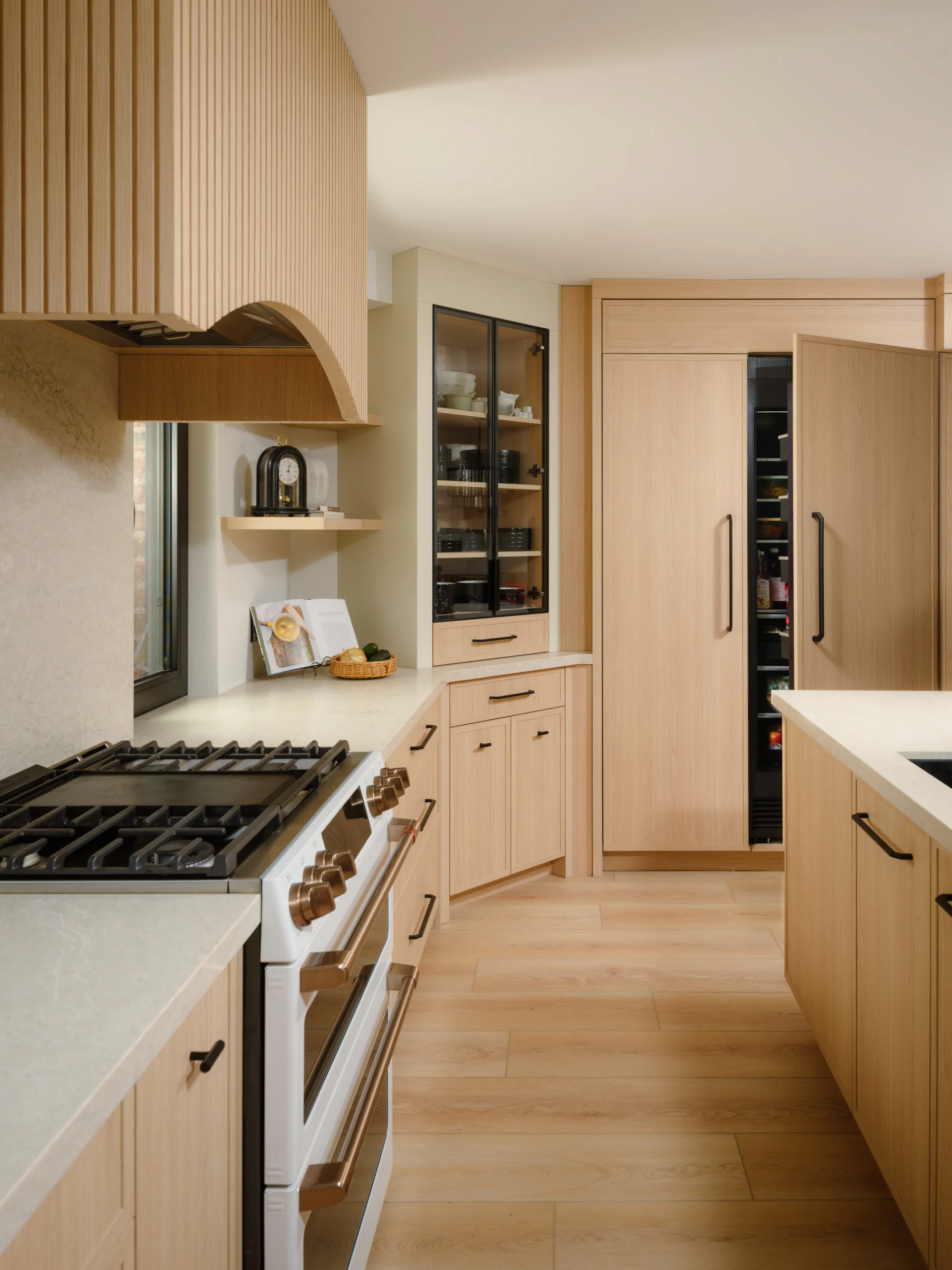Handcrafted custom range hood above the range in an Oakville custom kitchen