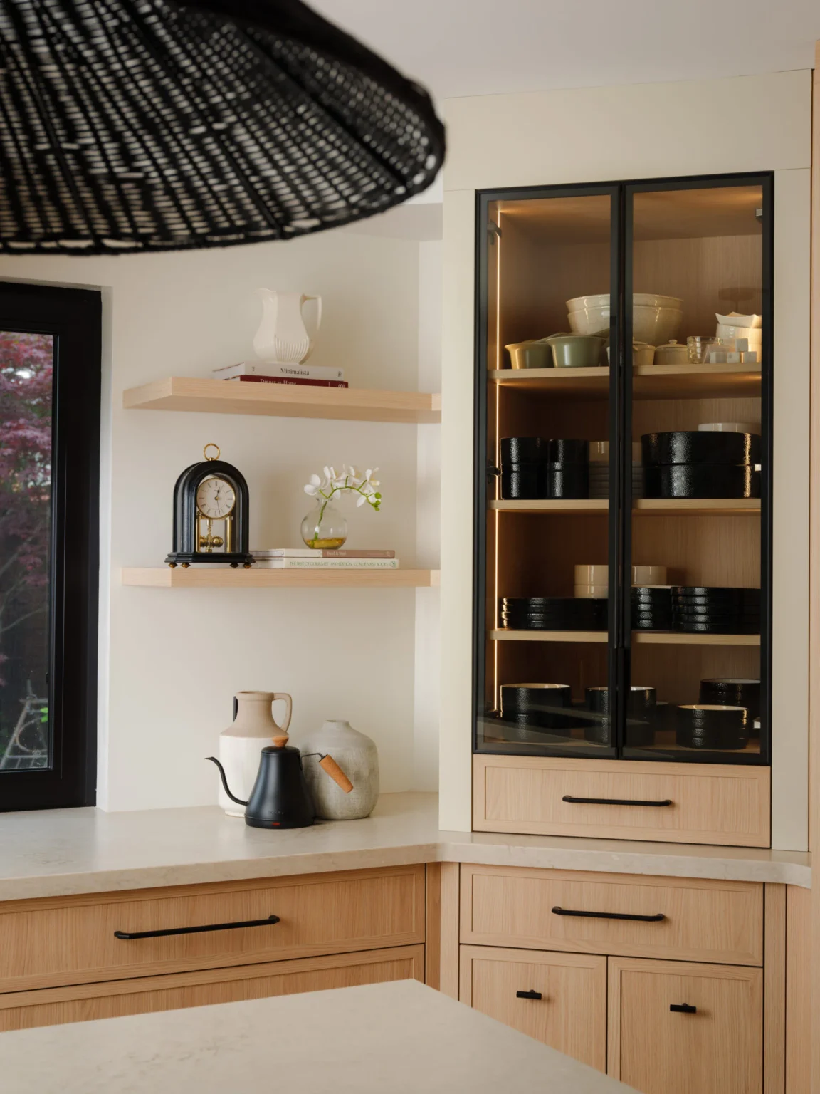Glass-front display cabinet and open shelving in an Oakville custom kitchen