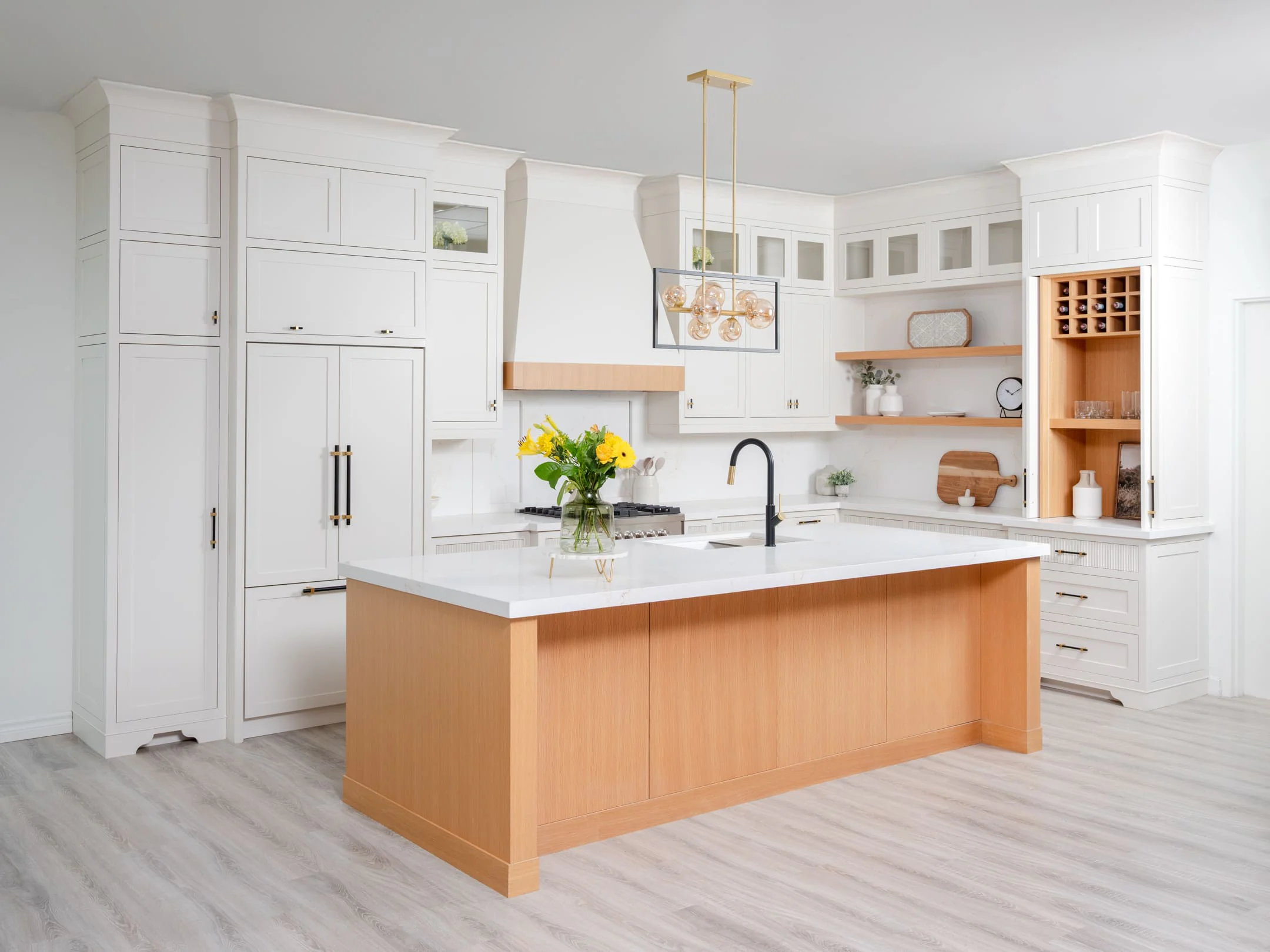 Cotswold kitchen with painted framed inset cabinetry and a white oak island