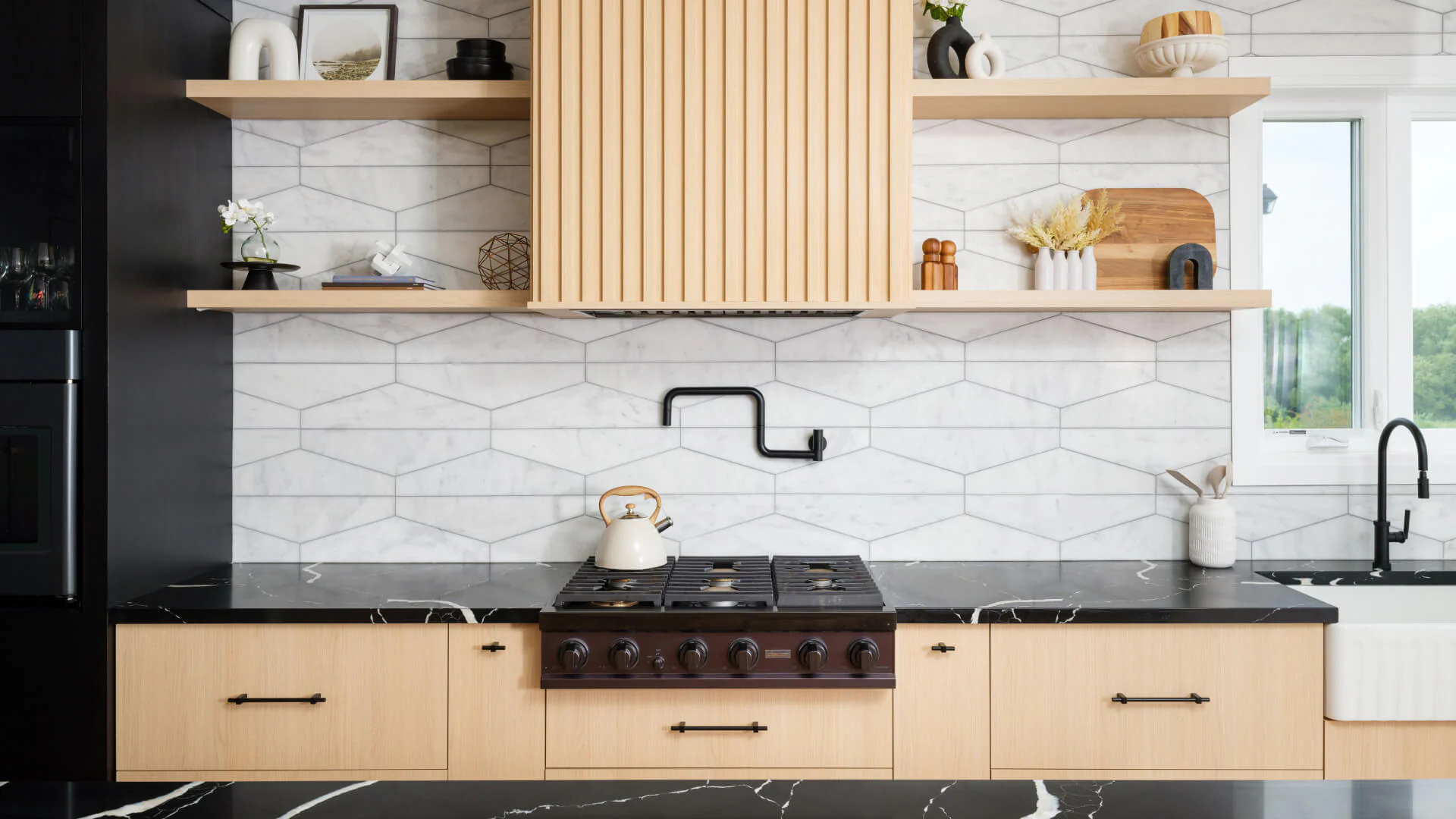 Range wall with a reeded wood hood, floating shelves and patterned backsplash