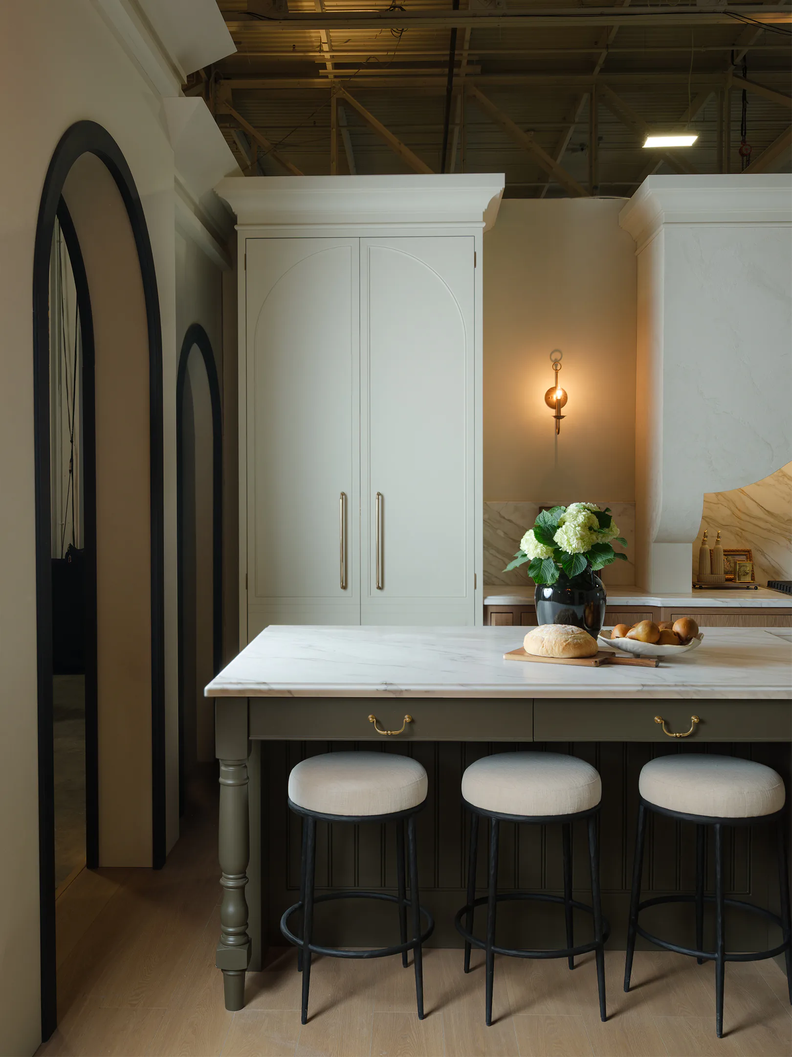Coffee bar and pantry closed behind white oak framed inset doors