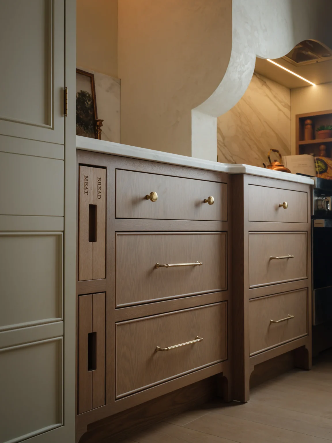 Drawers with built-in cutting boards in white oak cabinetry