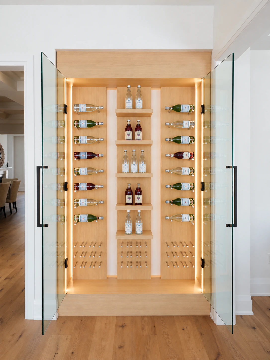 Full-height white oak display cabinet with glass doors, horizontal bottle storage and central display shelves